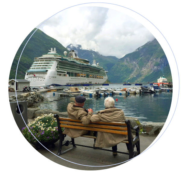 Retired couple looking at cruise ship